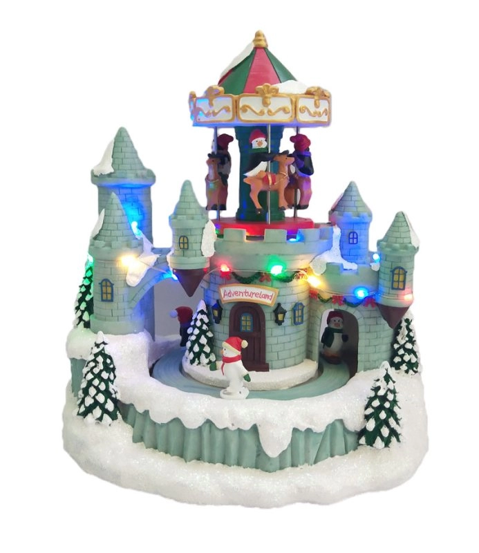Verlicht het kasteel van de kerstpinguïn met bewegende carrousel