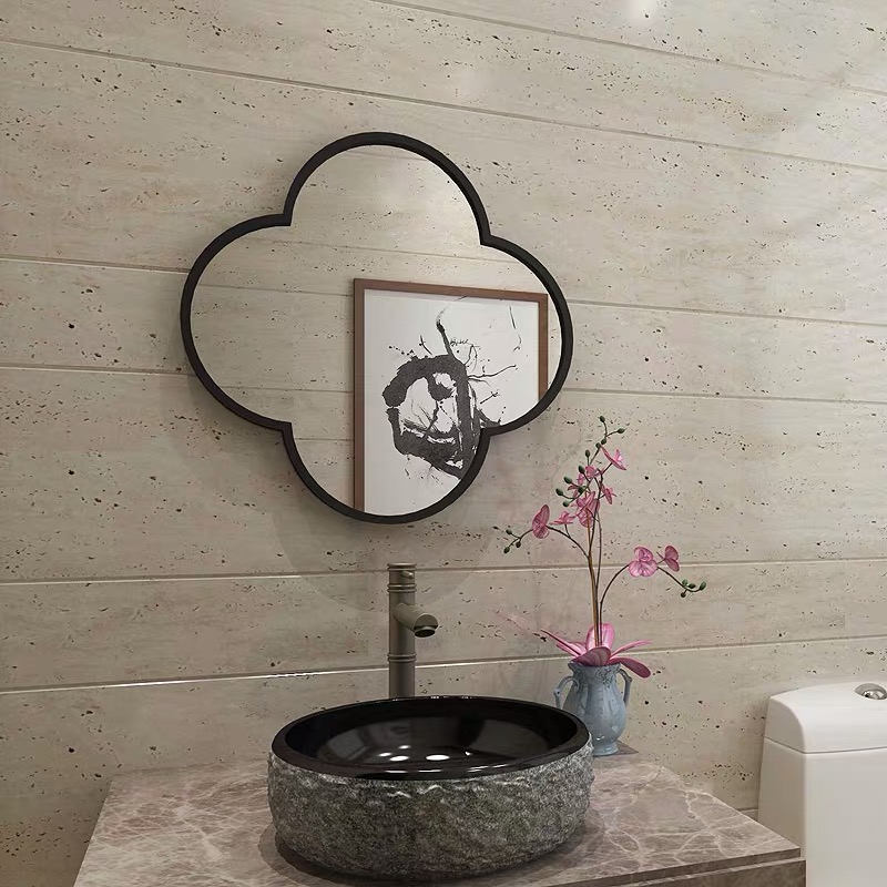 Black round metal wall mirror